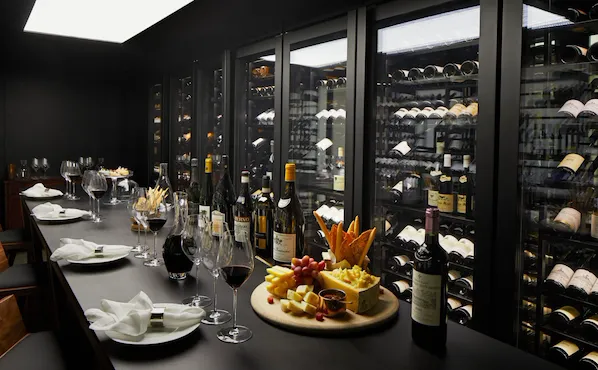 The Dorchester The Wine Vault, red wine being poured and cheese and fruit