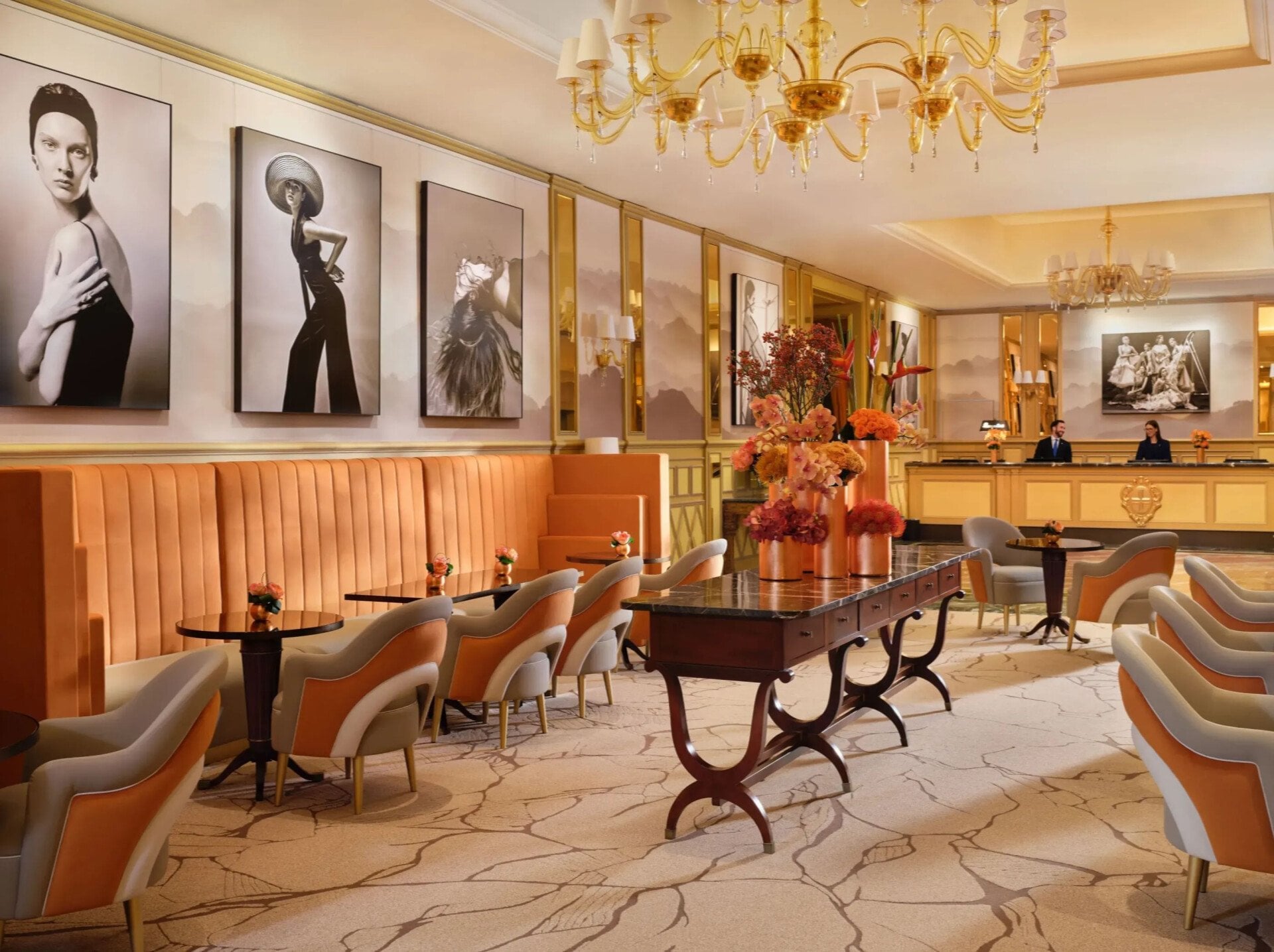 A view of 'Il Salotto’ with its characteristic orange, grey and ivory colours. The reception desk is in the background.