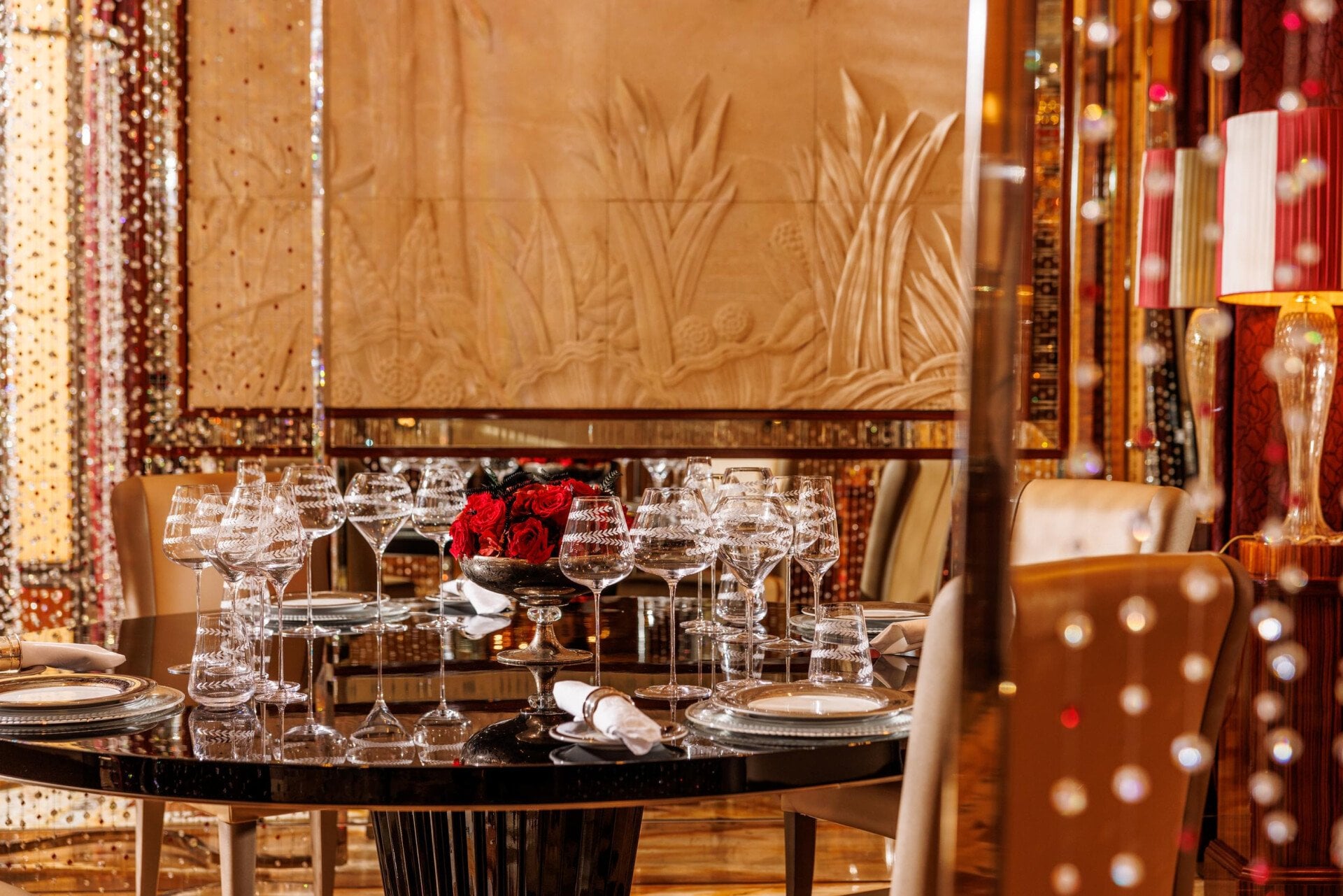view of Tavolo Cristallo with its Swarovsky curtains and red roses as centrepiece