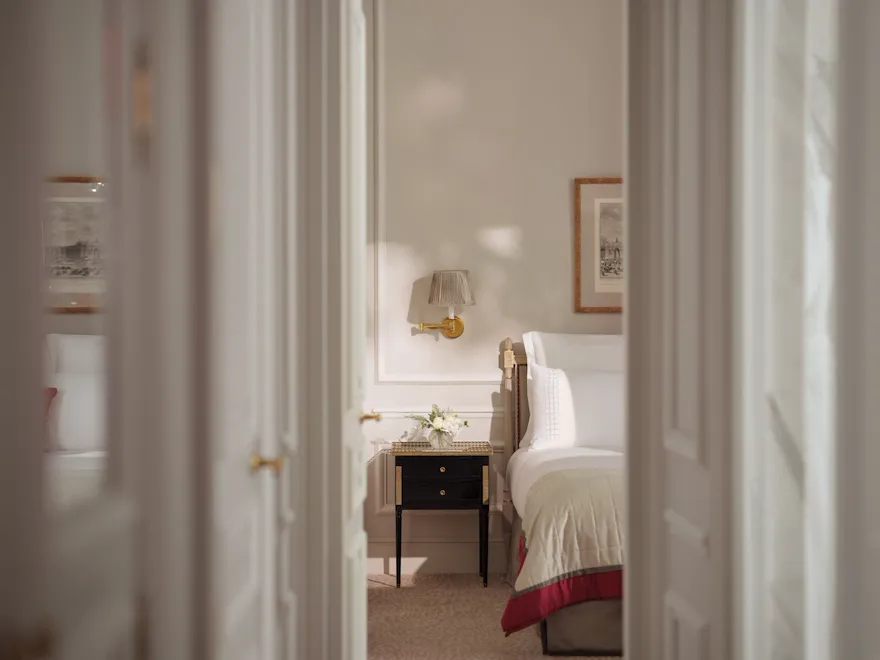 This is the bedroom of the Superior Suite #218 at the Plaza Athénée seen from the living room doors.