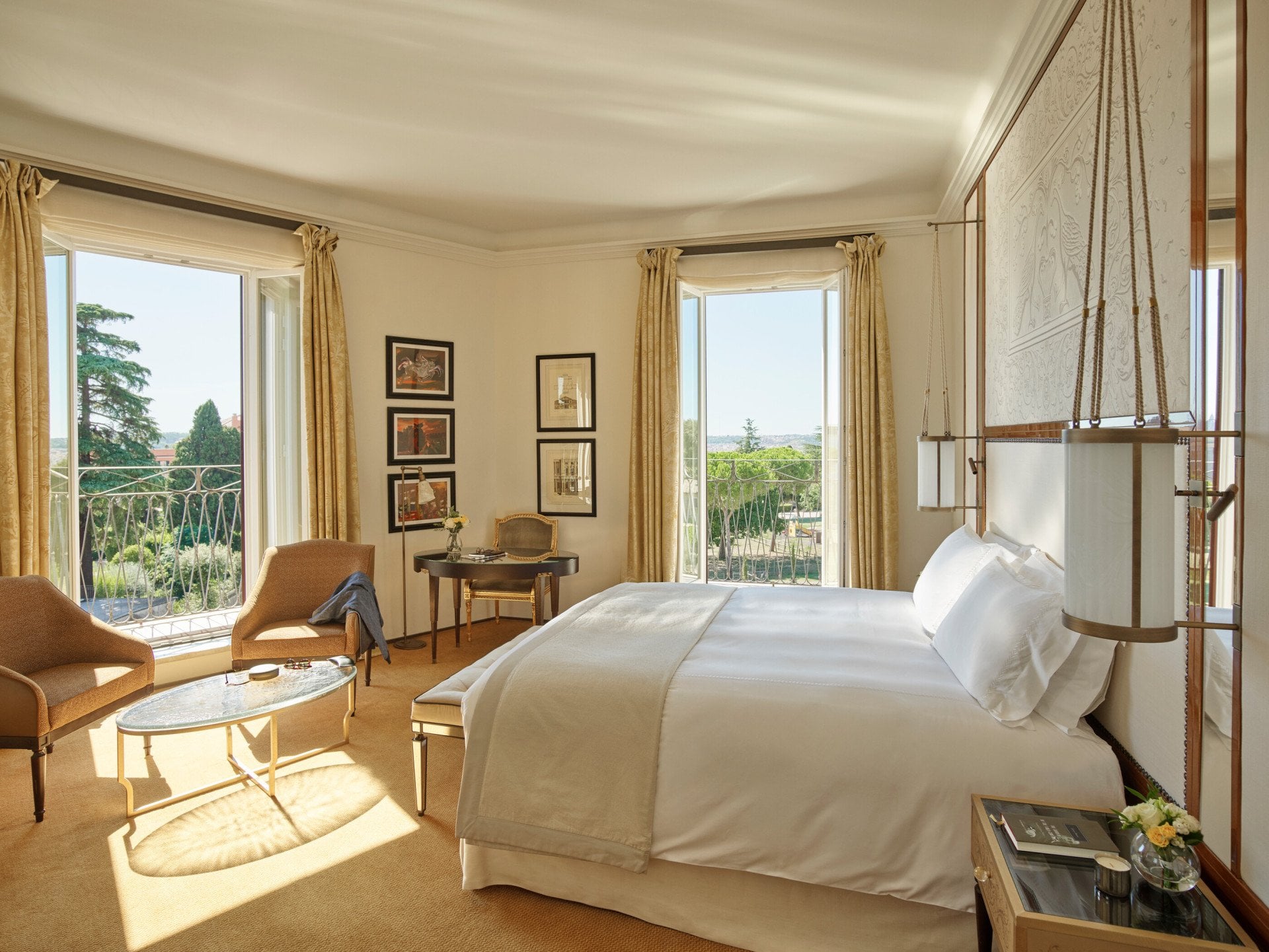 Junior Suite bedroom with windows open to view at Hotel Eden, Rome