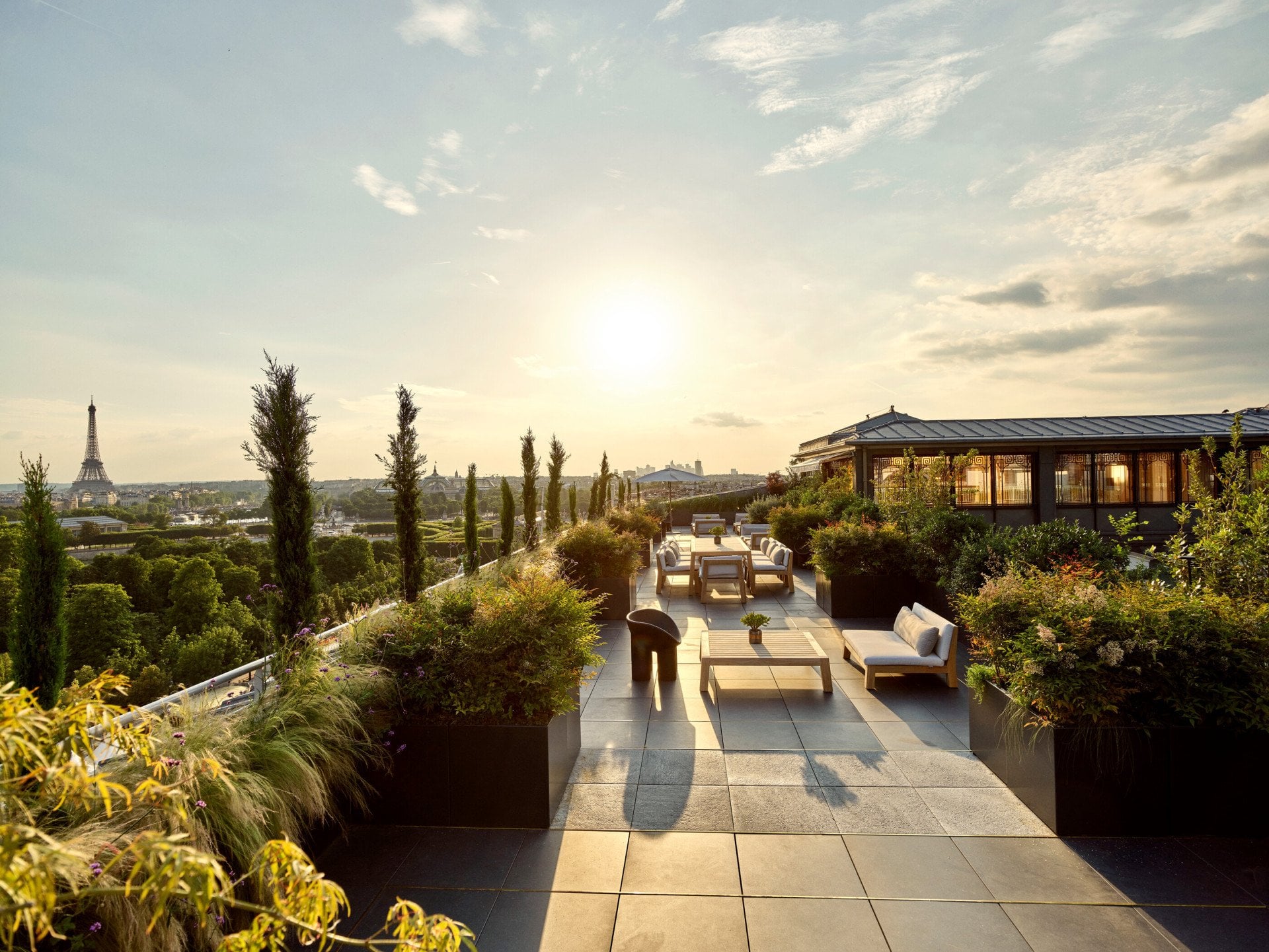 Belle Etoile suite terrace with sunset view of Eiffel Tower, at Le Meurice, Paris.