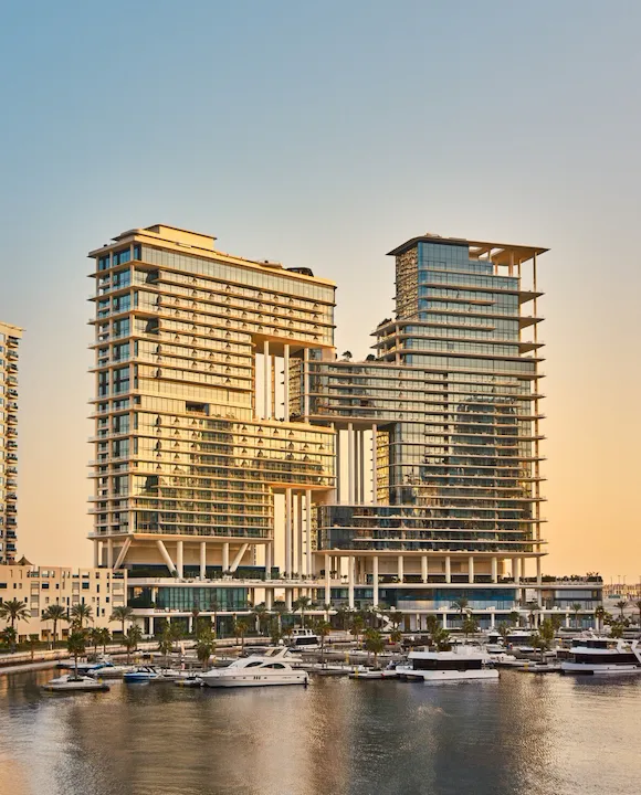 The Lana building viewed from the opposite side of the canal, during sunset