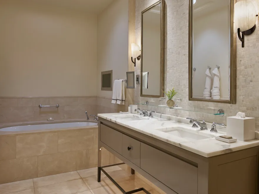 Vanity in marble bathroom of suite at Hotel Bel-Air