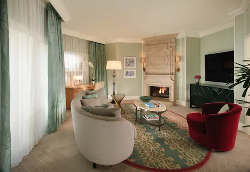 Beverly Hills Suite Living Room with fireplace on at The Beverly Hills Hotel