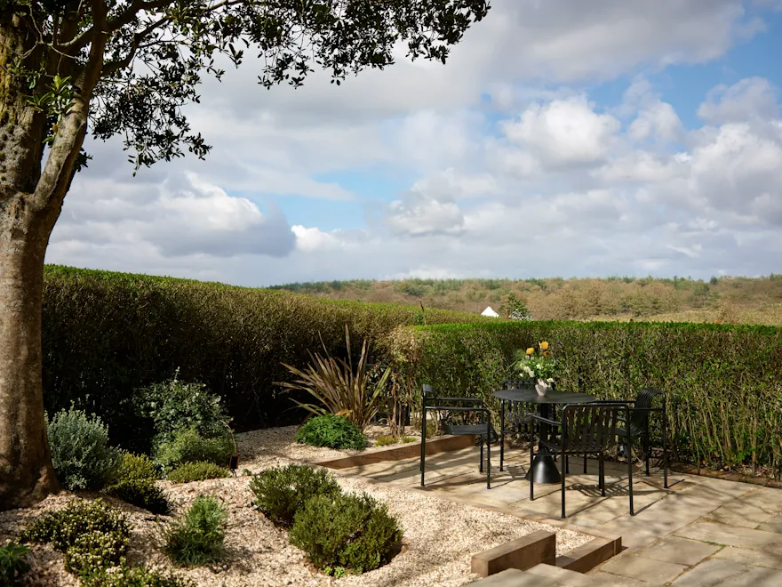 Private garden terrace with countryside views at the Gardeners West suite Coworth Park, Ascot