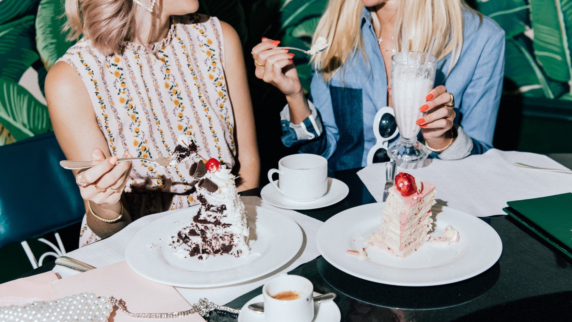 Friends eating cake and drinking milkshakes in The Fountain Coffee Room 