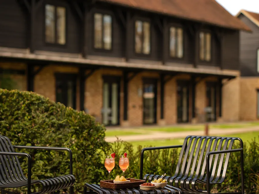 Private terrace with two chairs and afternoon refreshments outside Junior Suite at Coworth Park