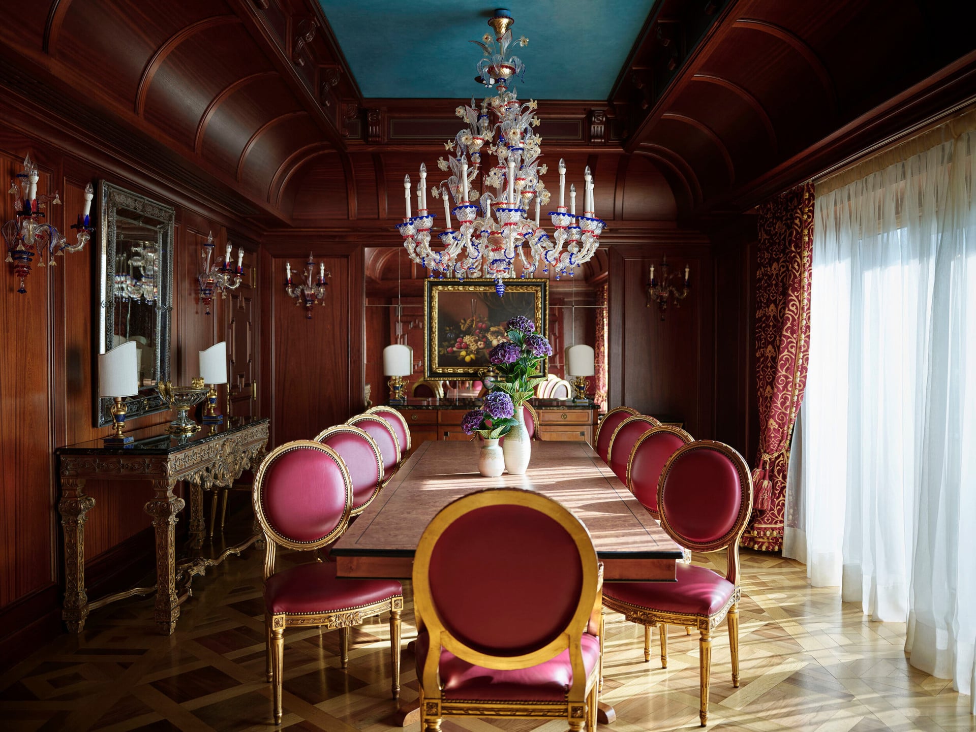 Presidential Suite dining room with beautiful and colorful flowers on the table 
